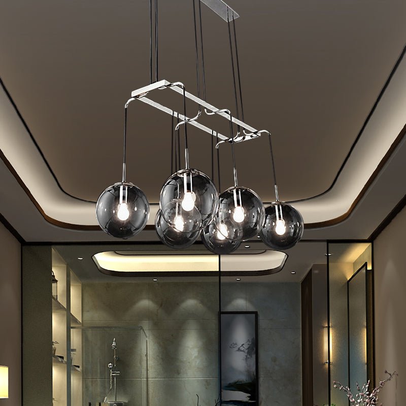 Industrial Black Ball 6-Light Pendant With Clear Glass And Linear Canopy Smoke Gray