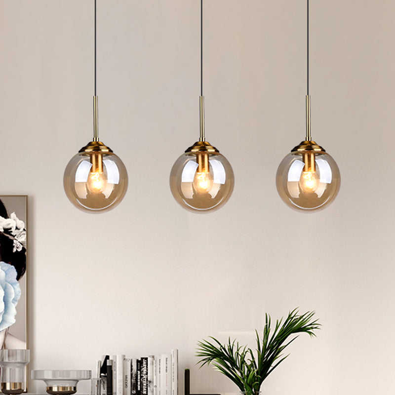 Brass Pendant Lamp With Spherical Amber/Smoke Glass Shade For Dining Room Ceiling