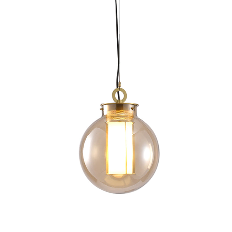 Lampe à pendule rétro dorée avec sphère/ellipse/conception oblongue en verre ambré et insert de cadre tubulaire (12,5"/19" H)
