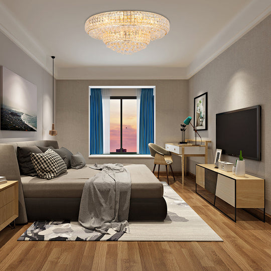 Plafonnier moderne en cristal transparent avec finition dorée pour salon