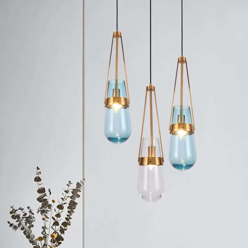 Clear/Blue Glass Pendant Lamp With Brass Gripper - Postmodern Drop Shape Dining Room Hanging Light