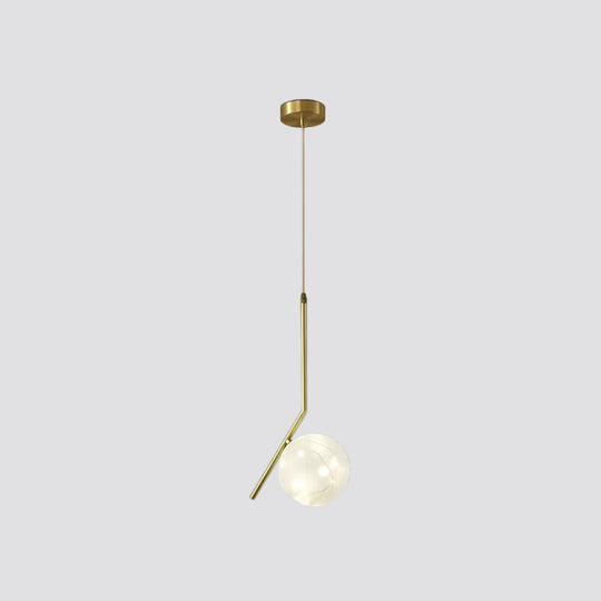 Sleek Brass Sphere Led Pendant Lamp For Modern Dining Rooms