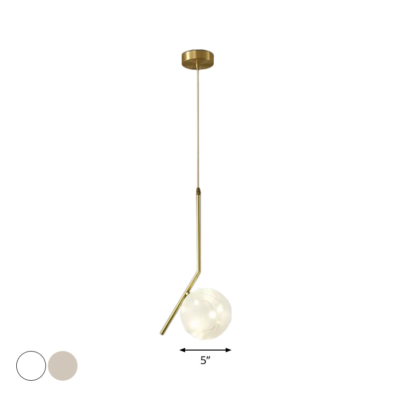Sleek Brass Sphere Led Pendant Lamp For Modern Dining Rooms