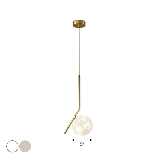 Sleek Brass Sphere Led Pendant Lamp For Modern Dining Rooms