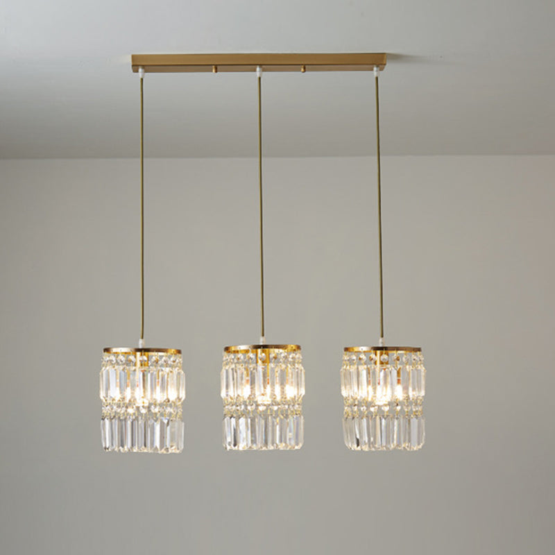 Lustre multi-lumières en laiton avec suspension cylindrique et cristal à trois prismes pour salle à manger contemporaine