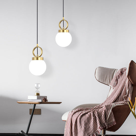 Opal Glass Dining Room Pendant Lamp with Elegant Gold Ring Top - Simplistic Ball Pendulum Light