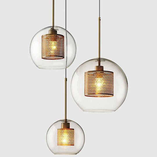Suspension moderne en verre transparent avec finition en laiton - Design géométrique et intérieur en maille