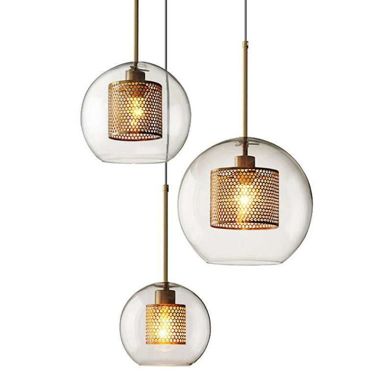Suspension moderne en verre transparent avec finition en laiton - Design géométrique et intérieur en maille