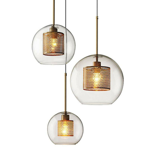 Suspension moderne en verre transparent avec finition en laiton - Design géométrique et intérieur en maille