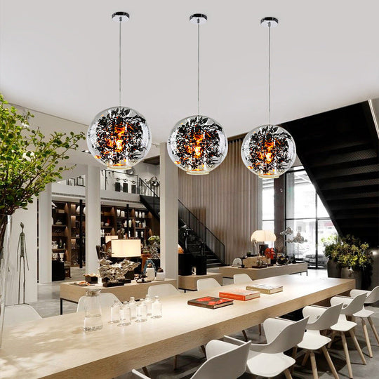 Modern Clear Glass Sphere Pendant Ceiling Light With Black Plant Design 1 Head Hanging Lamp