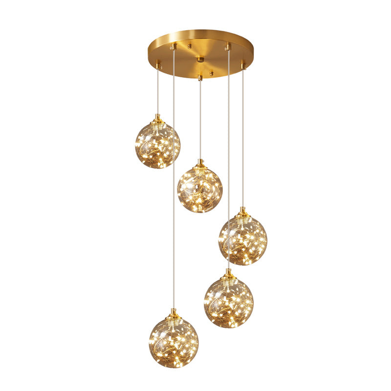 Nordic Amber Glass LED Pendant Lamp with Brass Finish and Starry Design for Bedroom