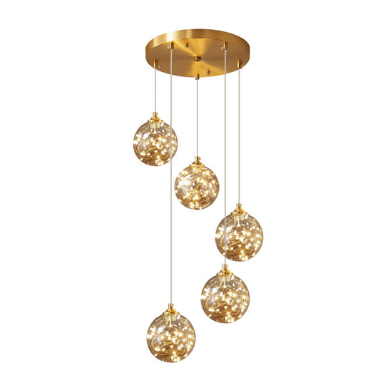 Nordic Amber Glass LED Pendant Lamp with Brass Finish and Starry Design for Bedroom