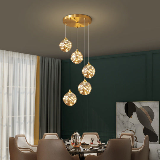 Nordic Amber Glass LED Pendant Lamp with Brass Finish and Starry Design for Bedroom