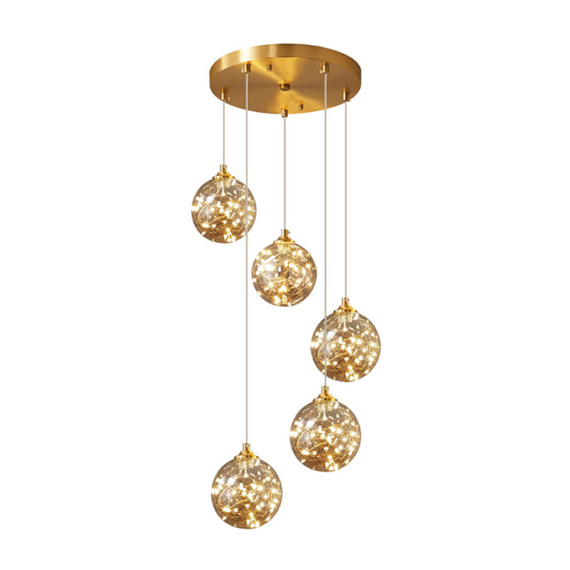 Nordic Amber Glass LED Pendant Lamp with Brass Finish and Starry Design for Bedroom