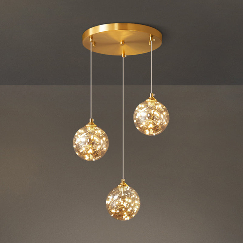Nordic Amber Glass LED Pendant Lamp with Brass Finish and Starry Design for Bedroom