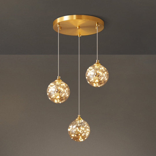 Nordic Amber Glass LED Pendant Lamp with Brass Finish and Starry Design for Bedroom