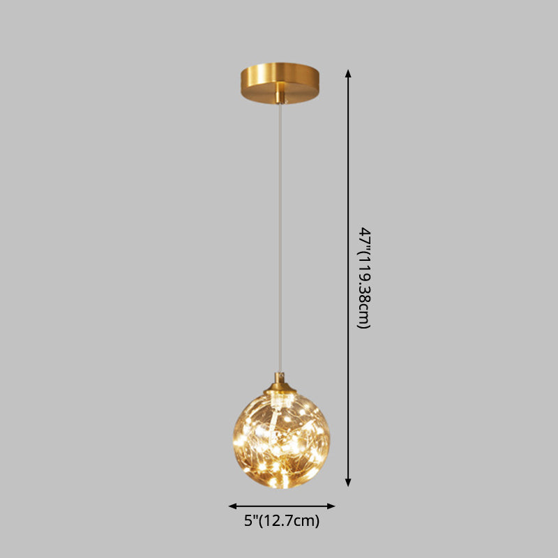 Nordic Amber Glass LED Pendant Lamp with Brass Finish and Starry Design for Bedroom