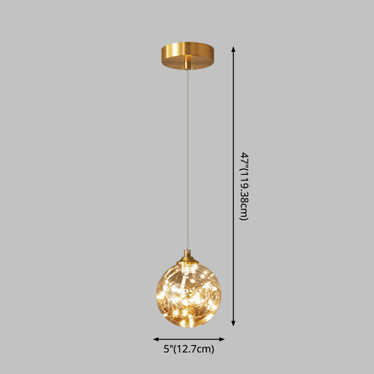 Nordic Amber Glass LED Pendant Lamp with Brass Finish and Starry Design for Bedroom