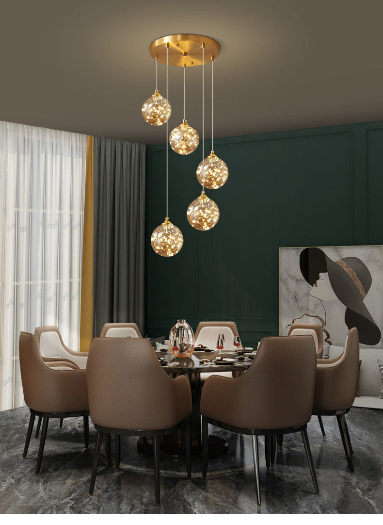 Nordic Amber Glass LED Pendant Lamp with Brass Finish and Starry Design for Bedroom
