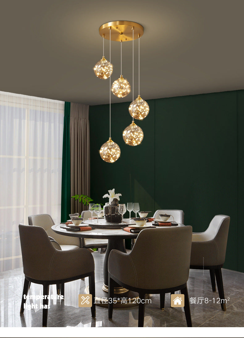 Nordic Amber Glass LED Pendant Lamp with Brass Finish and Starry Design for Bedroom