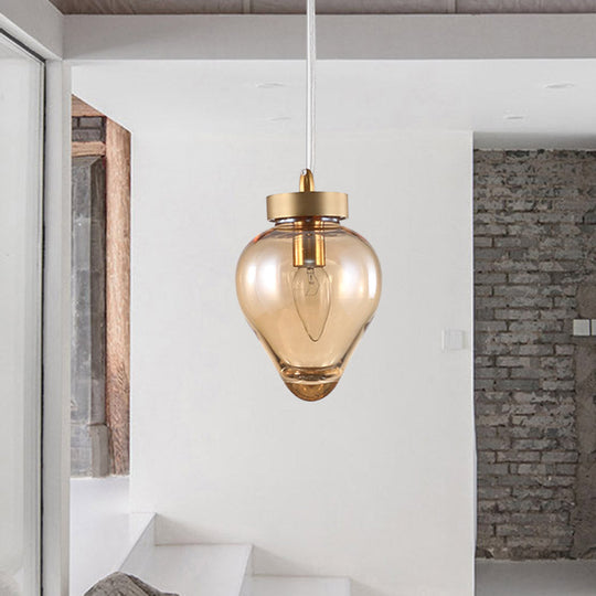 Modern Amber Glass Pendant With Gold Urn Design - Perfect For Dining Room Lighting