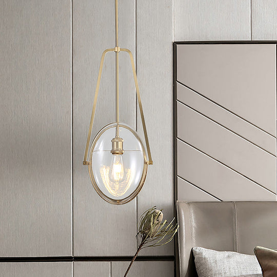 Modern Brass Pendant Light with Clear Glass Shade and Unique Halberd Frame