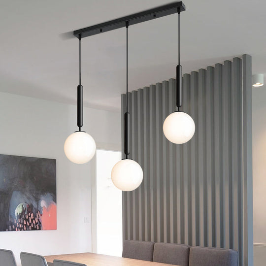 Modern 3-Bulb Black Orb Pendant Light with Cream Glass Shade