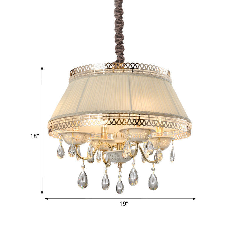 Lustre suspendu contemporain à 4 ampoules avec abat-jour tambour en tissu beige et éclairage vers le bas en cristal