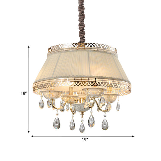 Lustre suspendu contemporain à 4 ampoules avec abat-jour tambour en tissu beige et éclairage vers le bas en cristal